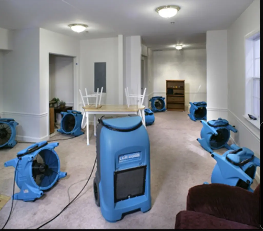 Air movers and dehumidifier setup for Water Damage Restoration in Justice
